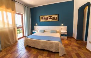Säng eller sängar i ett rum på Le Terrazze sul mare