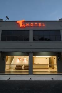 a store front with a store sign in the window at T Hotel Anggerik in Alor Setar