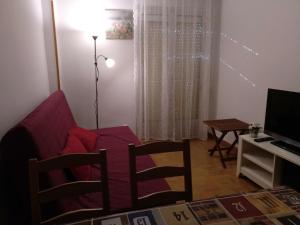 a living room with a couch and a table at Madrid Rent 4 in Madrid