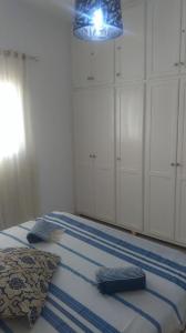 A bed or beds in a room at Appartement à Houmt Souk Jerba
