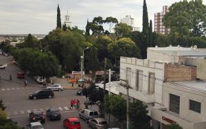 a view of a city street with cars and buildings at Hotel City in Trelew