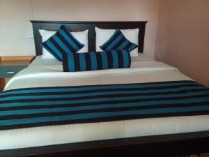 Postel nebo postele na pokoji v ubytování Blue Ribbon Homestay