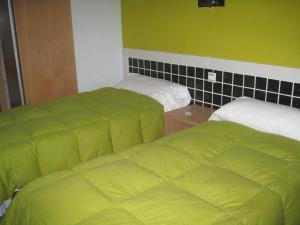 Postel nebo postele na pokoji v ubytování Hostal Ducal II