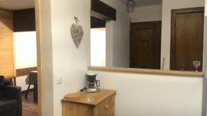 a room with a table with a heart on the wall at Les Esserts in Les Houches