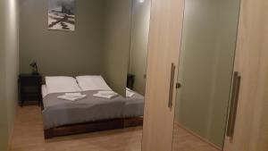 Posteľ alebo postele v izbe v ubytovaní apartament