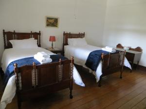 Postel nebo postele na pokoji v ubytování Roode Bloem Farm House