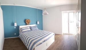 Ένα ή περισσότερα κρεβάτια σε δωμάτιο στο Penthouse Salento - Galatina