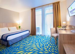 Кровать или кровати в номере Tulip Inn Sofrino Park Hotel