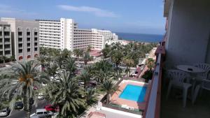 a view from a balcony of a building with a pool at Tajinastes in Arona