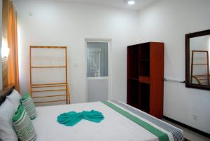 Ένα ή περισσότερα κρεβάτια σε δωμάτιο στο Village Villa