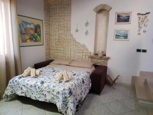 Ліжко або ліжка в номері Residenza Borgo Antico