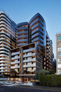 a rendering of a building with two tall buildings at Tyrian Albert Park Lake in Melbourne