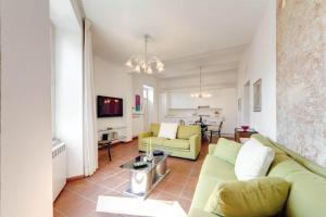 a living room with a couch and a table at Rhome Apartments Latini in Rome