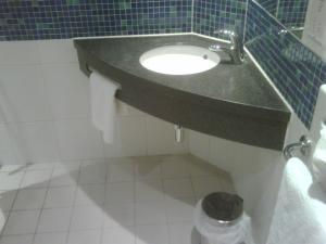 a bathroom with a black sink and a toilet at Holiday Inn Express Ramsgate – Minster by IHG in Minster
