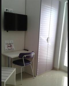 a room with a desk and a chair next to a window at Sweet Home in Falerna +7 photos