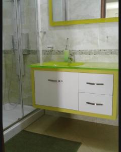 a bathroom with a sink and a shower at Sweet Home in Falerna