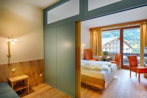 Postel nebo postele na pokoji v ubytování Hotel NockResort