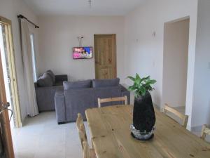 a living room with a table and a couch at Villa Mambo in Patrana