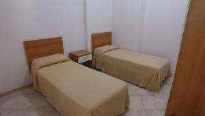 a room with two beds in a room at International Camping Village in Praia a Mare