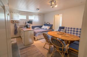 a small living room with a table and a couch at Oak House in Naantali