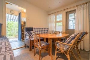 a room with a table and chairs and a bed at Oak House in Naantali +17 photos