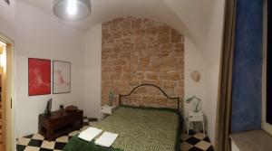 Postel nebo postele na pokoji v ubytování Calamarù