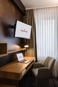 TV tai viihdekeskus majoituspaikassa Hotel Esplanade Dortmund