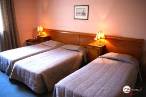 Postel nebo postele na pokoji v ubytování Hotel il Castello Borghese
