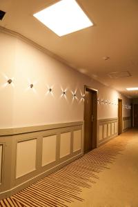 a long hallway with a ceiling with stars on the wall at Hotel Lion Sofia in Sofia