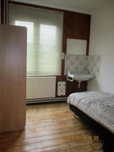Postel nebo postele na pokoji v ubytování House Rumpen Brunssum