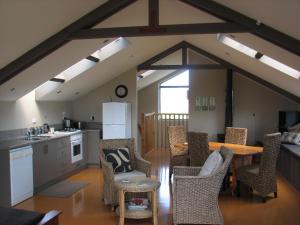 a kitchen and dining room with a table and chairs at Barberry Hill in Stratford