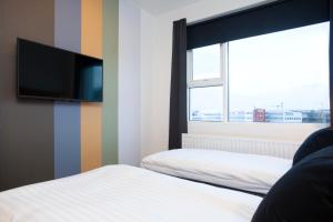 Postel nebo postele na pokoji v ubytování 201 Hotel