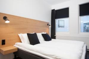 Postel nebo postele na pokoji v ubytování 201 Hotel