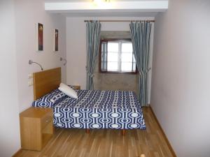 Postel nebo postele na pokoji v ubytování Hortas P.R.