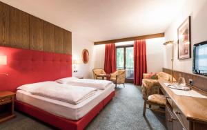 Rúm í herbergi á Hotel Grüner Baum