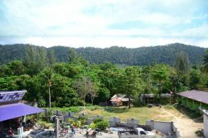 an aerial view of a resort with a field and trees at Best Stay Hostel At Lanta in Ko Lanta