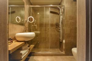 a bathroom with a sink and a shower at Congo Palace in Athens