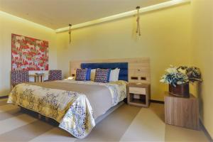 a bedroom with a king sized bed and a table at Congo Palace in Athens