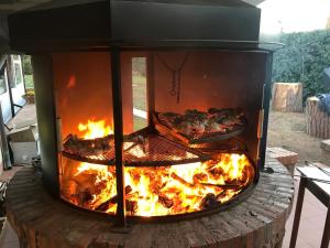 a fire oven with pizzas cooking in it at Locanda Di Ansedonia - Ristorante GRIGL"io" in Orbetello