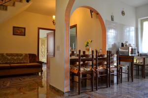a dining room with a table and chairs at Casa del Girasole in Genazzano