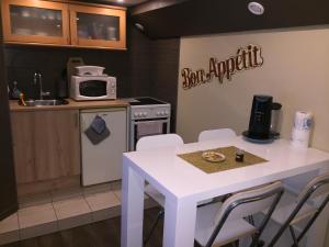 Kuchyň nebo kuchyňský kout v ubytování Résidence "Au Charron de Geis'pitz"
