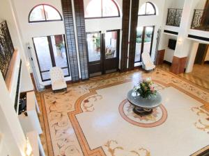 an aerial view of a lobby with a fountain in the middle at Naples Bay Resort and Marina in Naples