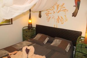 Ліжко або ліжка в номері Oasis de Grande Anse