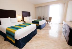 Postel nebo postele na pokoji v ubytování Crown Paradise Club Cancun - All Inclusive