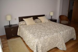 Postel nebo postele na pokoji v ubytování Apartamentos Alameda