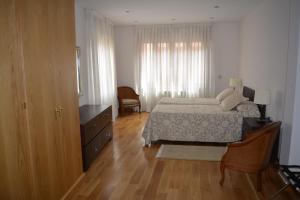 Postel nebo postele na pokoji v ubytování Apartamentos Alameda