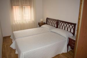 Postel nebo postele na pokoji v ubytování Apartamentos Alameda