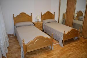 Postel nebo postele na pokoji v ubytování Apartamentos Alameda