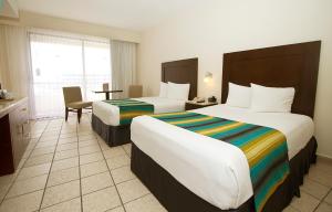 Postel nebo postele na pokoji v ubytování Crown Paradise Club Cancun - All Inclusive