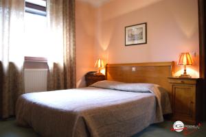 Postel nebo postele na pokoji v ubytování Hotel il Castello Borghese